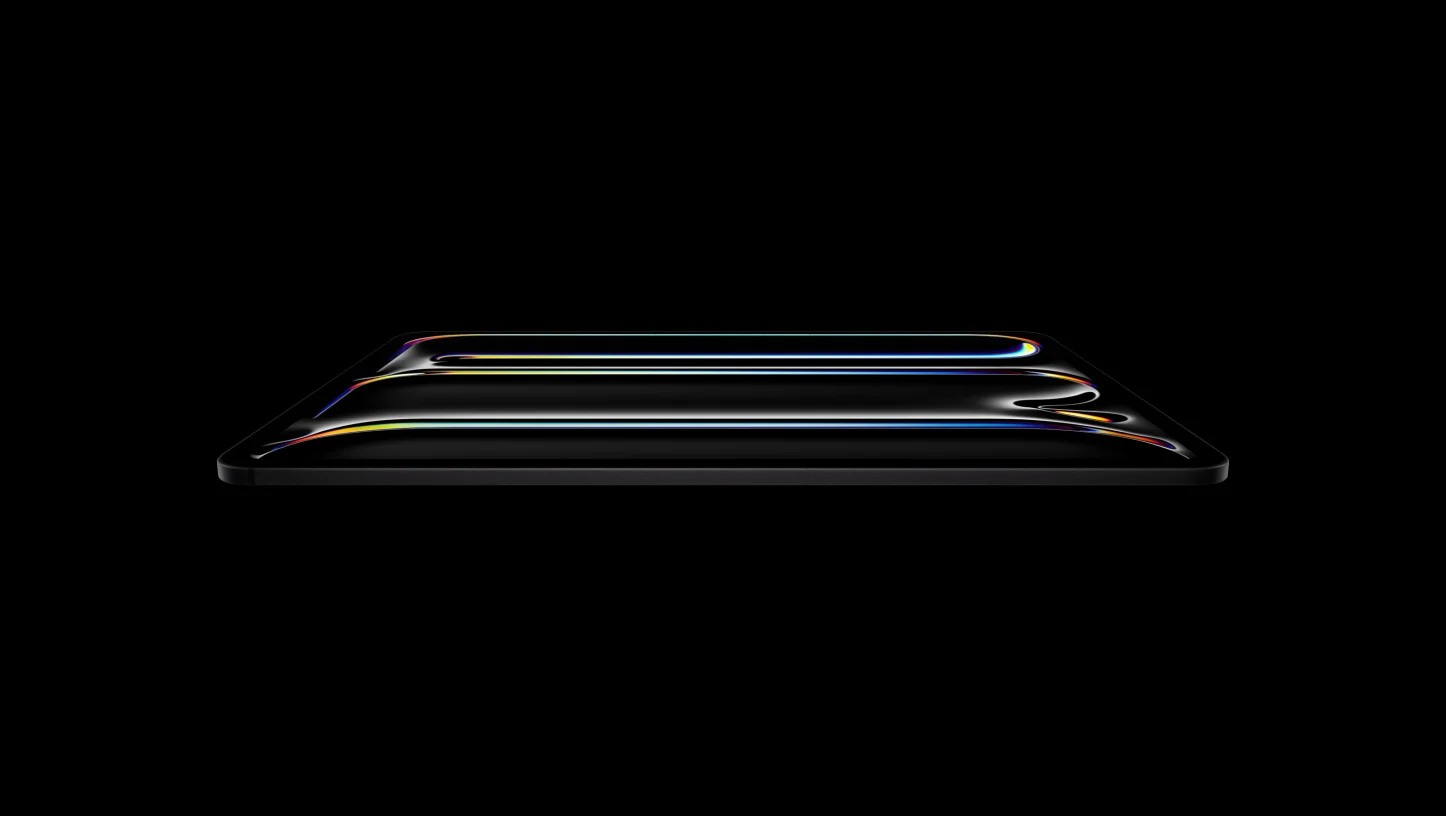 Apple iPad Pro shown in a low side profile against a black background.